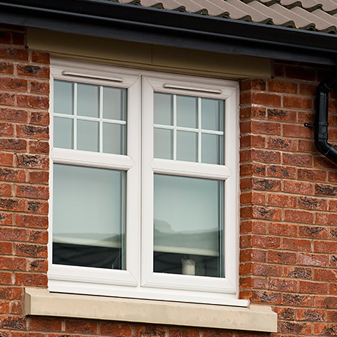 modern white window design on brick wall showing 13 energy efficiency features