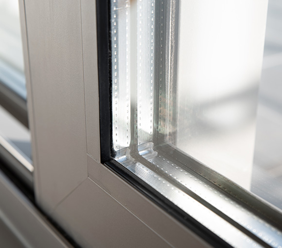 close-up view of gray window corner highlighting glass and frame details ideal for modern architecture and energy efficiency 6 benefits